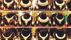 Gold price dips globally, hiked locally 