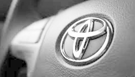Toyota cuts production further on virus issues, chip woes 