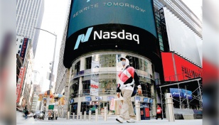 Nasdaq ends atop 16,000 mark for the first time on tech strength 