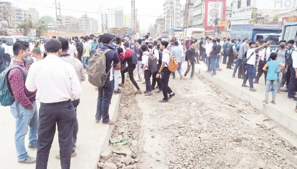 Students in Gazipur block highway for half fare in buses 