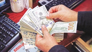 Dollar firms in soft holiday trading 