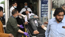 Many dead as blasts rock Afghan cities 