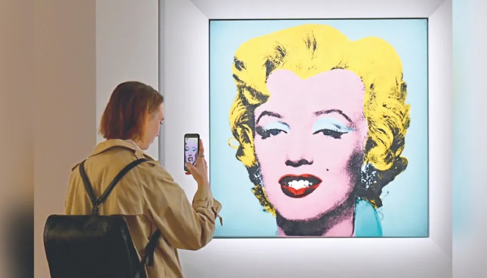 Warhol portrait of Marilyn Monroe fetches record $195m