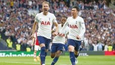 Spurs crush 10-man Arsenal to keep top-four bid alive 
