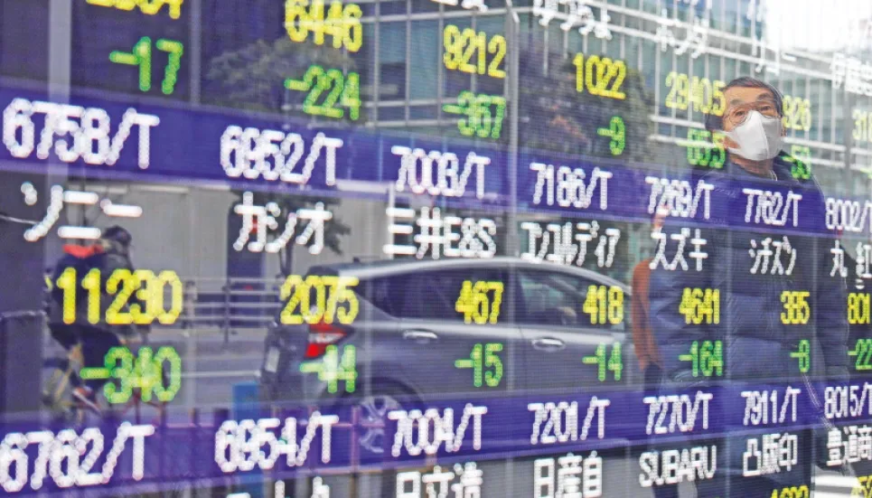 Tokyo shares close higher on weaker yen 