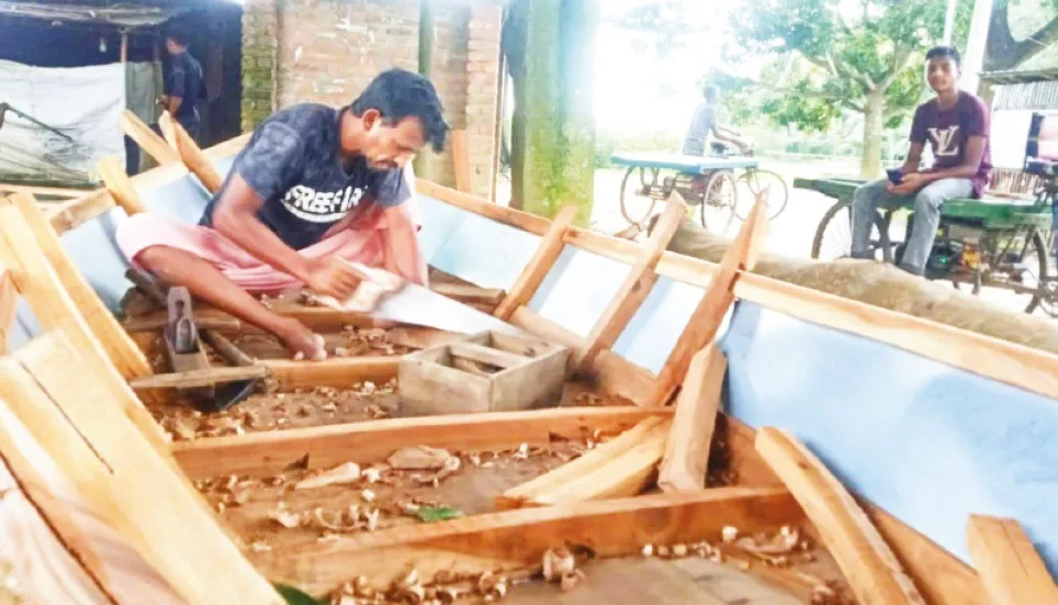 Boat makers passing busy time in Natore 