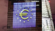 Euro jumps, stocks wobble after hefty ECB hike 