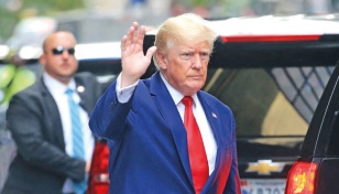 Trump heads to NY court to surrender on criminal charges