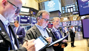 As US markets churn, some stick with energy shares 