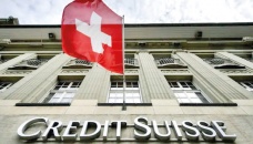 Credit Suisse shares sink to new record lows 