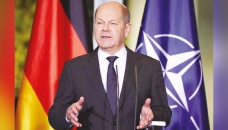 Germany’s Scholz weathers shocks in turbulent first year 