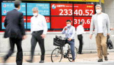World stocks waver as investors catch central bank jitters