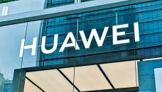 Huawei reports huge drop in profits as US sanctions bite