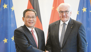 Chinese premier in Germany as Western mistrust mounts