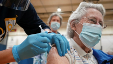 US hits 70pc vaccination rate, month late amid surge