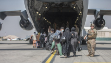 Taliban issue new warning against airlift extension as deadline looms