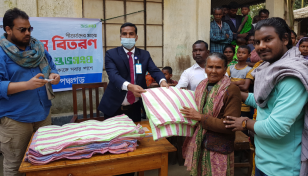 Bashundhara Group distributes winter clothes among cold-hit people in Panchagarh