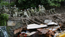 Rescuers in Japan hunt for 80 missing after deadly landslides