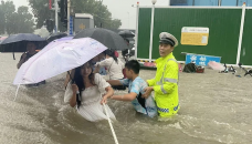At least 25 dead as China blasts dam to divert floods