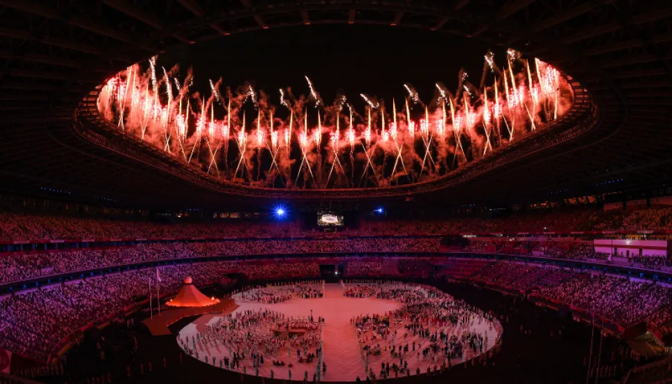 Tokyo Olympics open in low-key ceremony without fans