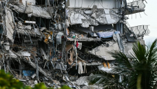 Crews comb rubble of collapsed Florida condo, 99 unaccounted for