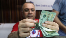 Lebanese carry 'worthless' stacks of cash after currency crash