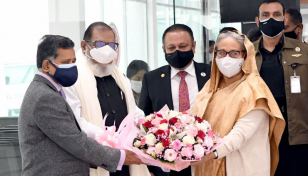 PM returns home from Paris