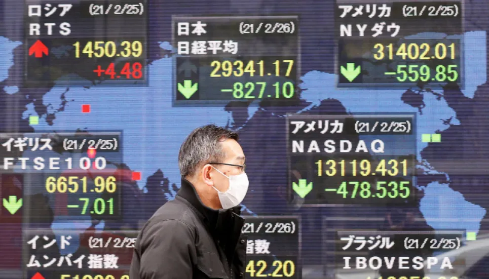 Asian markets swing as traders keep worried eye on inflation