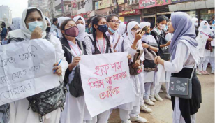 Students block Bakshibazar road protesting rape threat over half fare