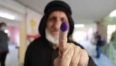 Iraqis head to early vote with little hope for change