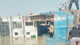 Ferry loaded with vehicles capsizes in Padma