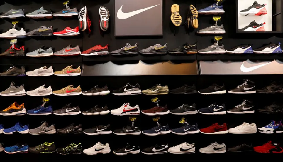 Nike warns on holiday delays, cuts full-year sales estimate
