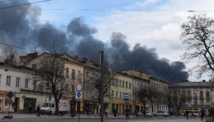 Air strikes hit western Ukraine as Russia forces mass in the east