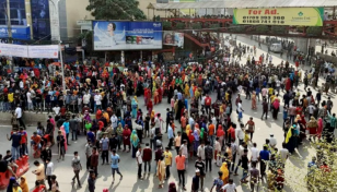 RMG workers block Mirpur-11 road demanding due wages