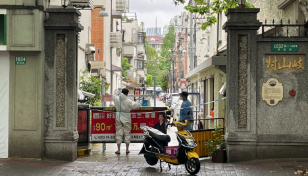 Shanghai fences up Covid-hit areas, fuelling fresh outcry