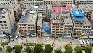 Five rescued from China building collapse