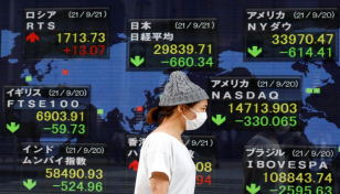 Asian markets tumble after Powell's rate hike warning