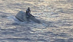 Teams search through night for 39 missing from capsized boat off Florida