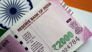 Indian rupee breaches 80 per dollar, hits new record low