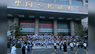 China banks vow to repay more customers after protests