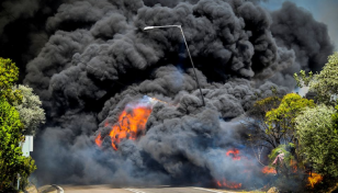 Wildfires burn coastal homes, forests in Greece as heatwave spreads east