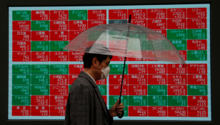 Asian markets drop as inflation spike fans rate fears