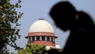 India's SC delivers split judgment on hijab ban