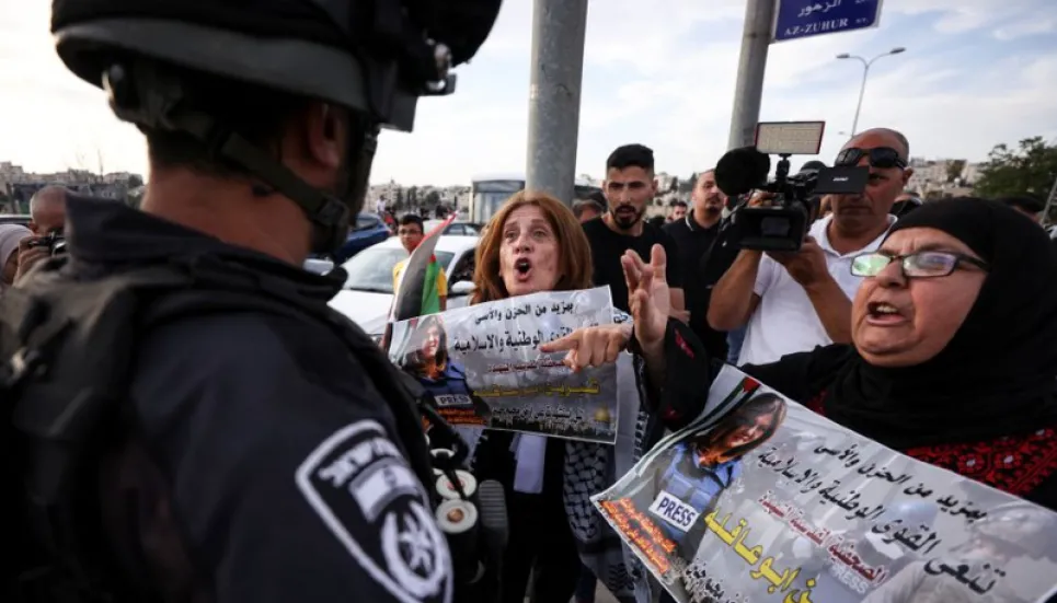 Police clash with mourners at Palestinian journalist's funeral