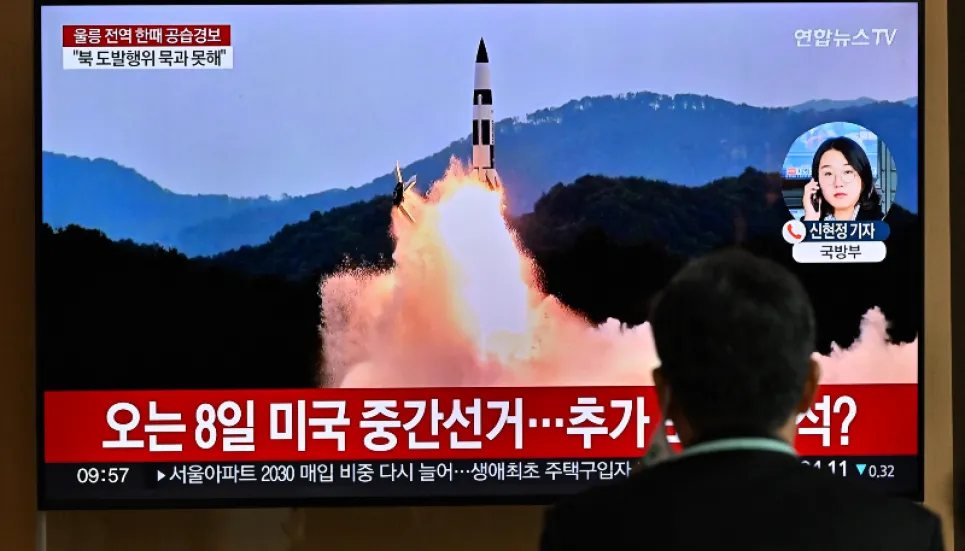 North Korea fires more than 20 missiles, one close to South