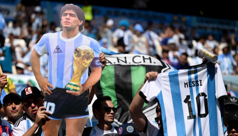 Fans pay homage to Maradona with shirts and chants