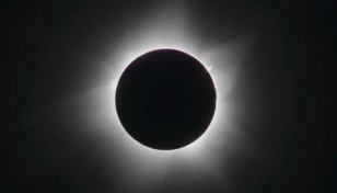 Pacific solar eclipse dazzles stargazers
