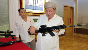 North Korean leader Kim inspects weapons factories