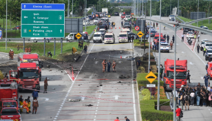 10 killed in light plane crash on street in Malaysia