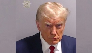Trump arrested in election case, mugshot released